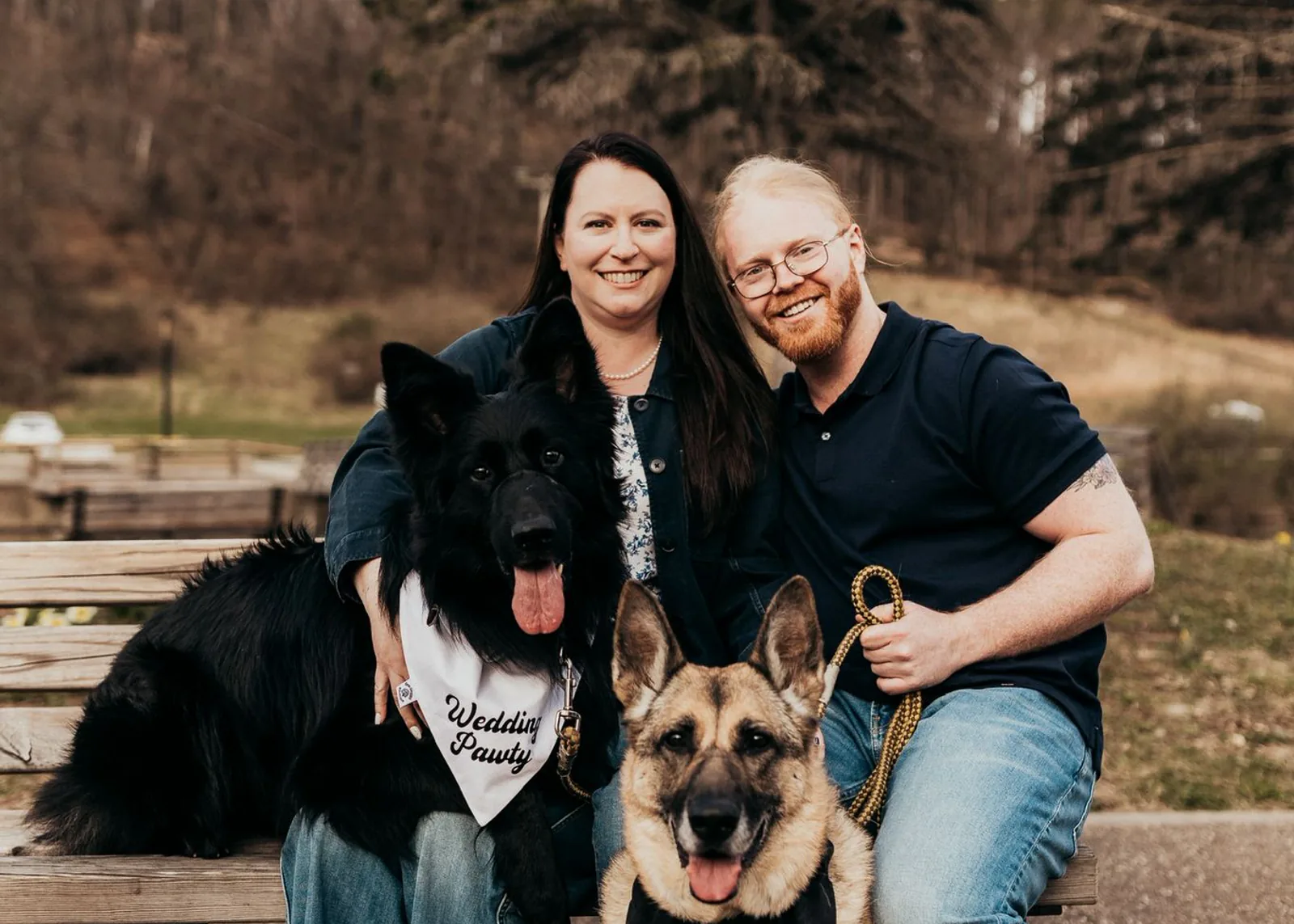 Dr. Katelyn Hilands outdoors with a companion and her two German shepherds